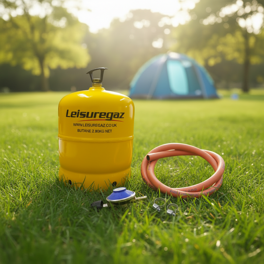 A yellow Leisuregaz butane cylinder shown with an orange hose, a blue-and-black regulator, and two metal clamps
