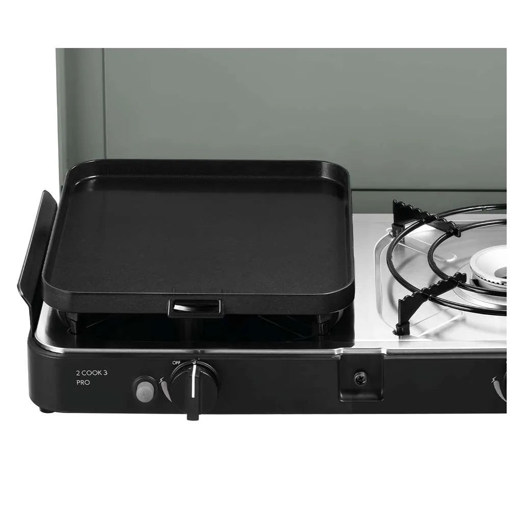 Portable gas grill with a black griddle on a white background