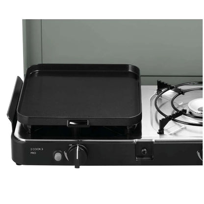 Portable gas grill with a black griddle on a white background