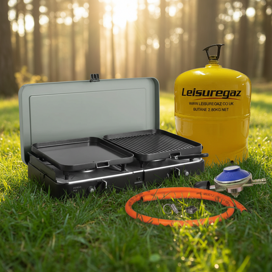 Portable camping stove with a yellow gas canister and hose