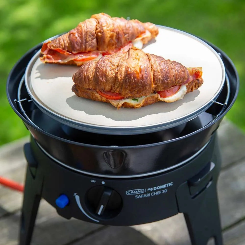 Croissants with fillings on a portable grill with 'Cadac Dometic Safari Chef 30' branding.