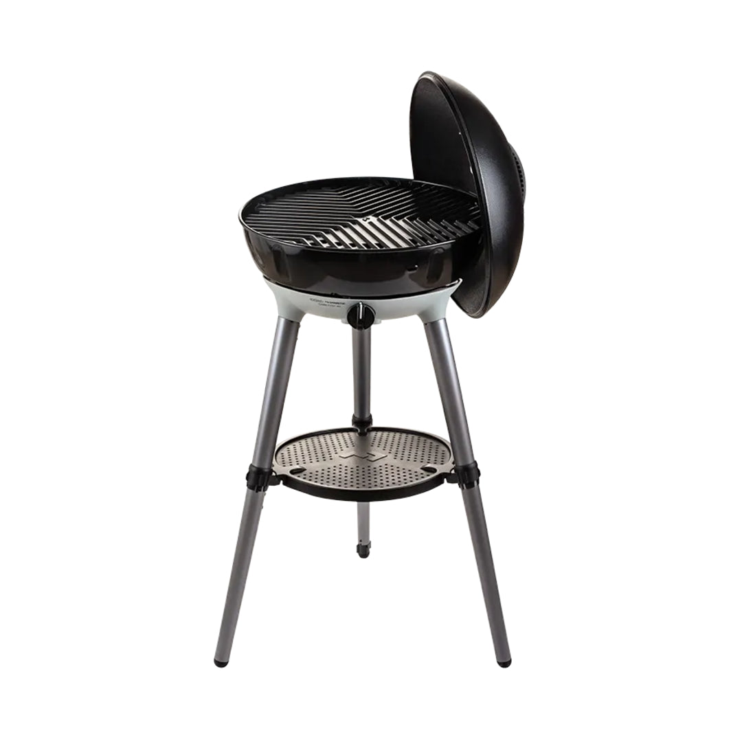Black barbecue grill with a lid on a white background