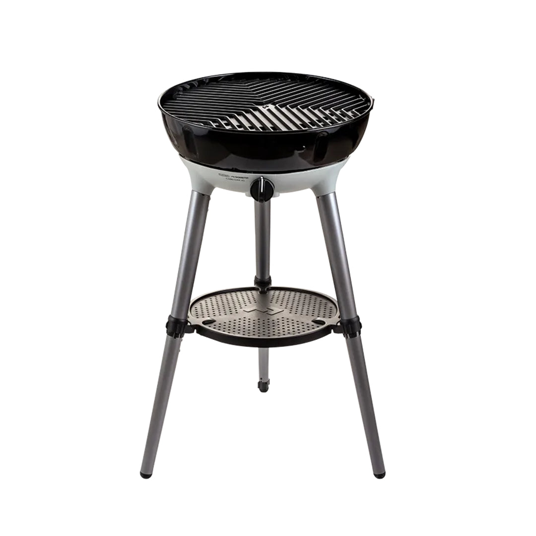 Portable grill with a black grilling surface and metal stand on a white background